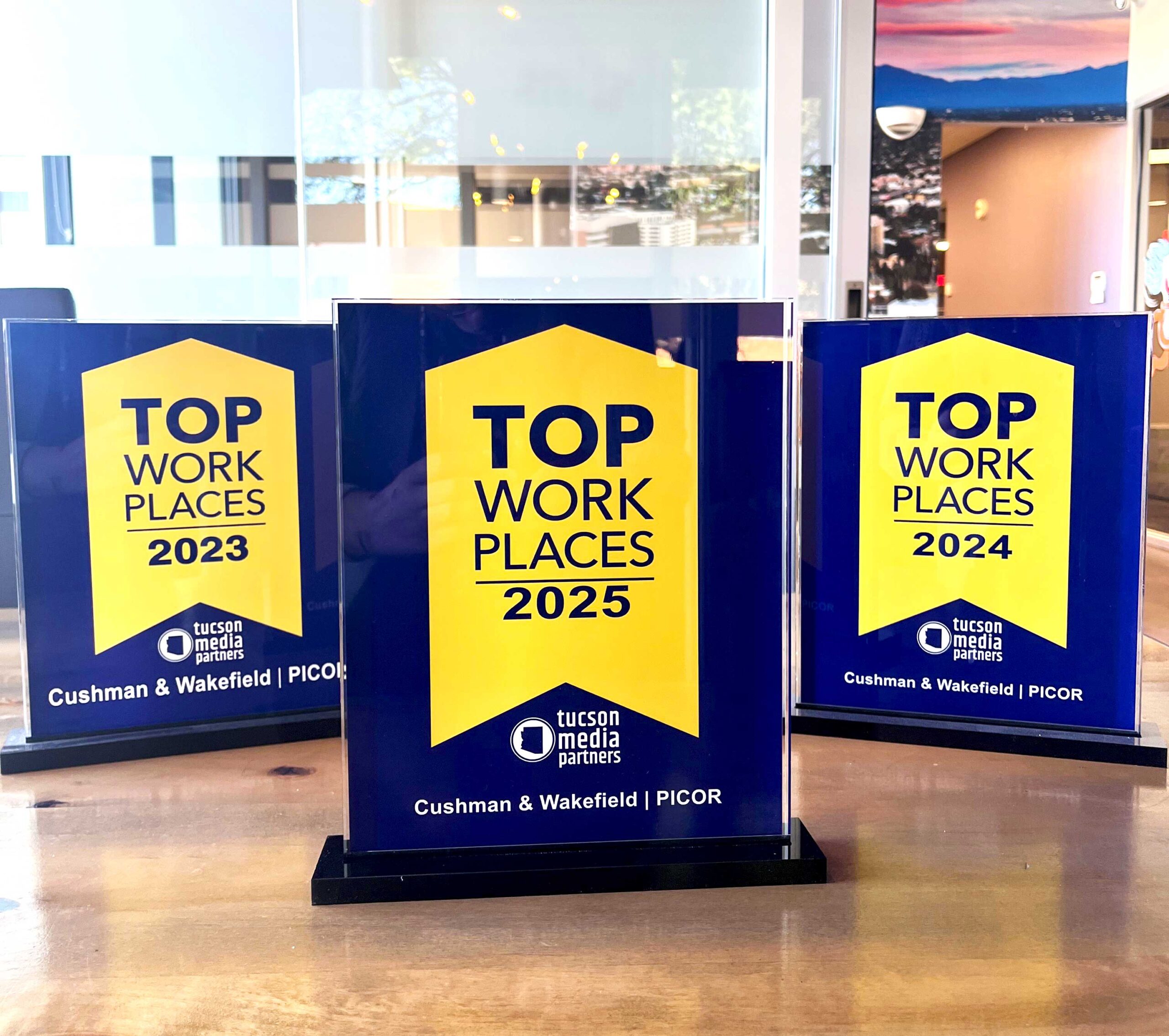 Photo of all three Top Workplace Awards C&W | PICOR has received 